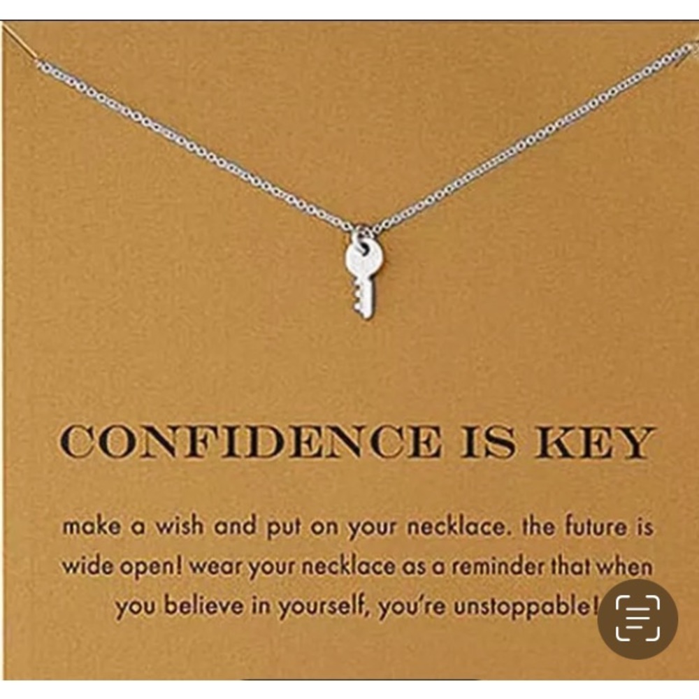 Key necklace on card.  Confidence is key.  Brand new!